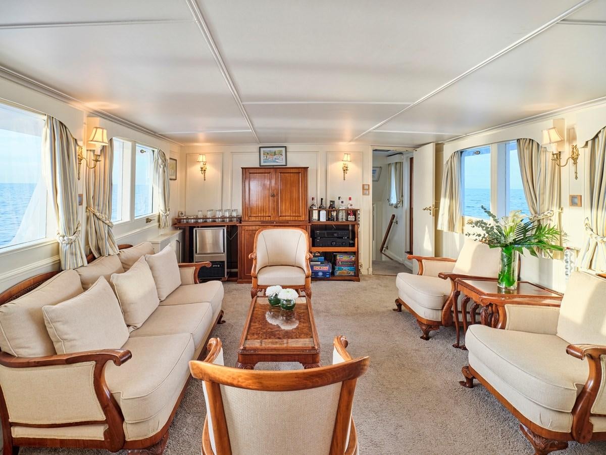 a living room with a couch and a table aboard MIDNIGHT SUN Yacht for Sale