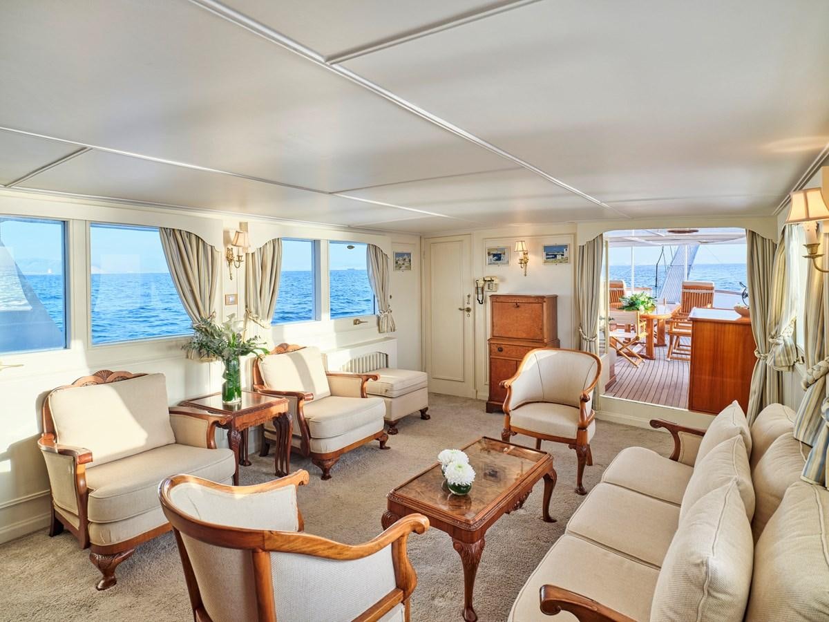 a living room with a table and chairs aboard MIDNIGHT SUN Yacht for Sale
