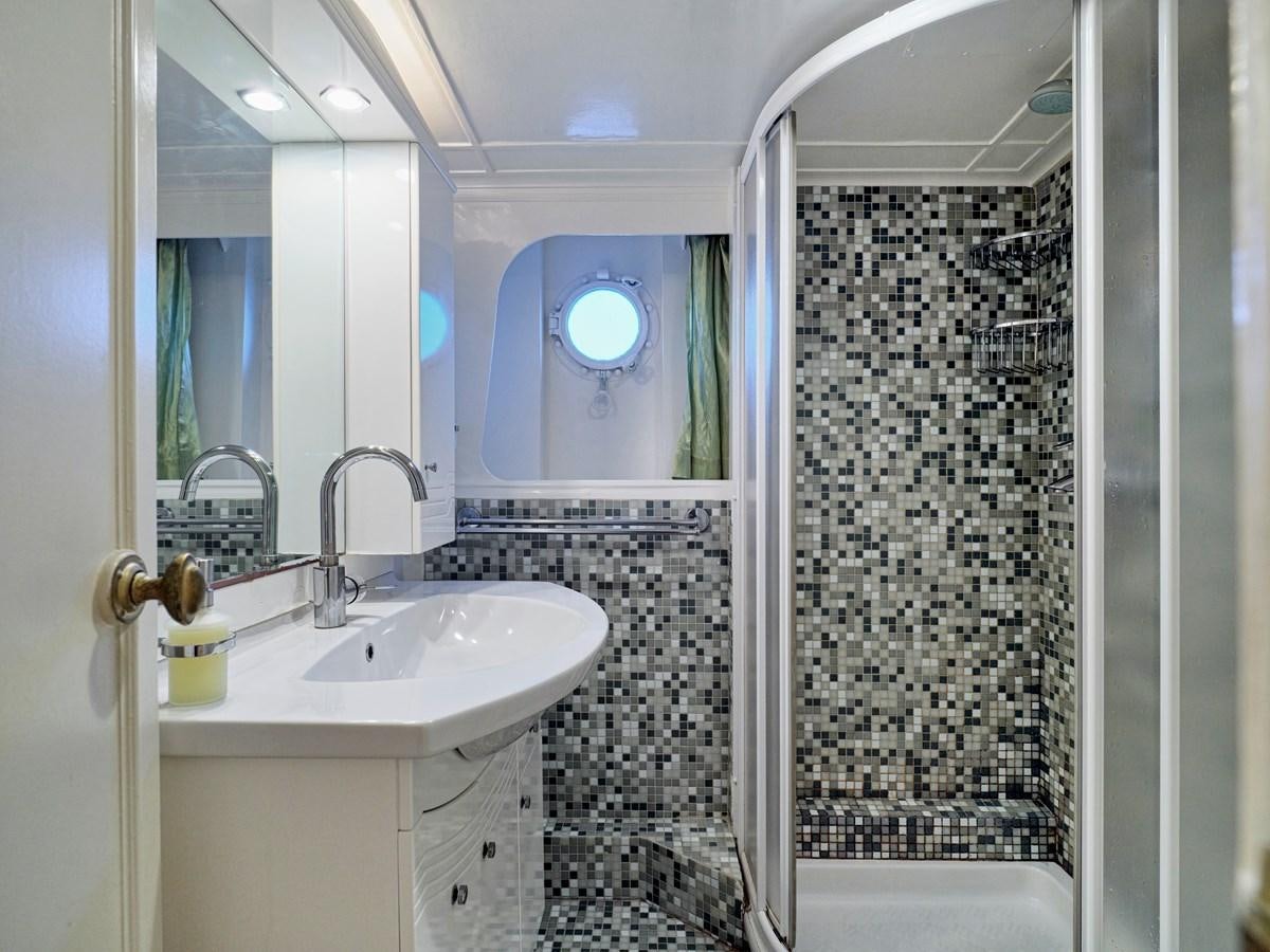 a bathroom with a sink and a shower aboard MIDNIGHT SUN Yacht for Sale