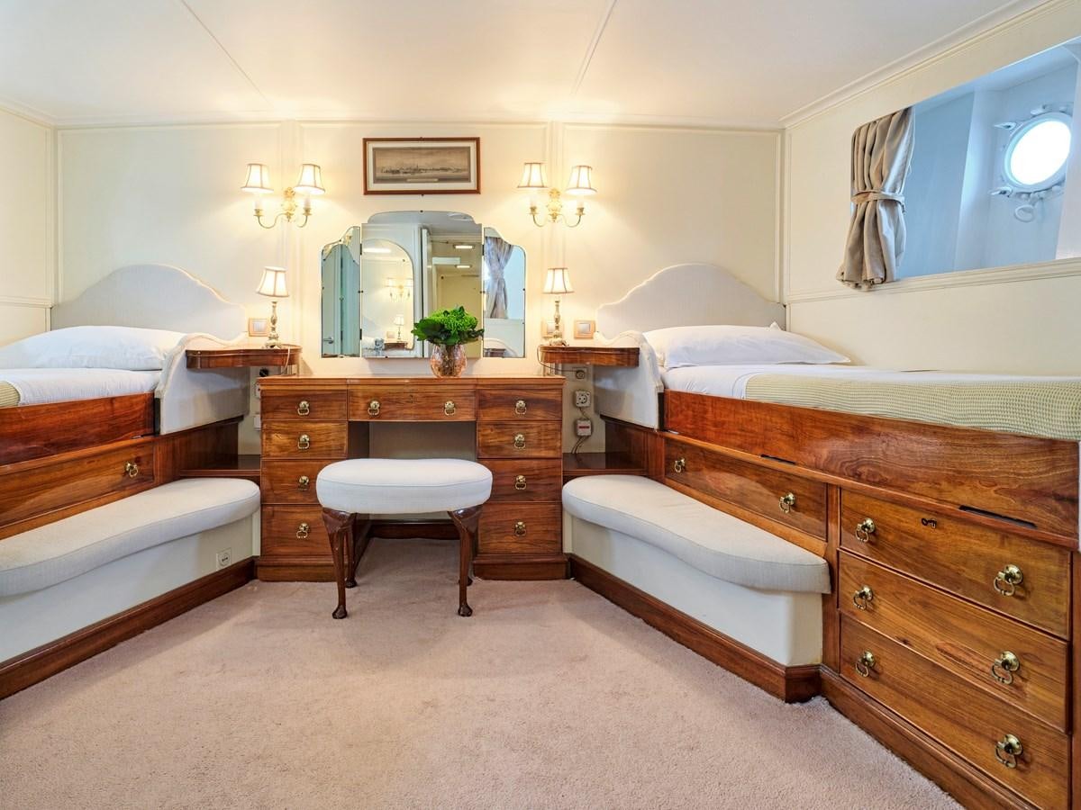 a bedroom with a vanity and a mirror aboard MIDNIGHT SUN Yacht for Sale