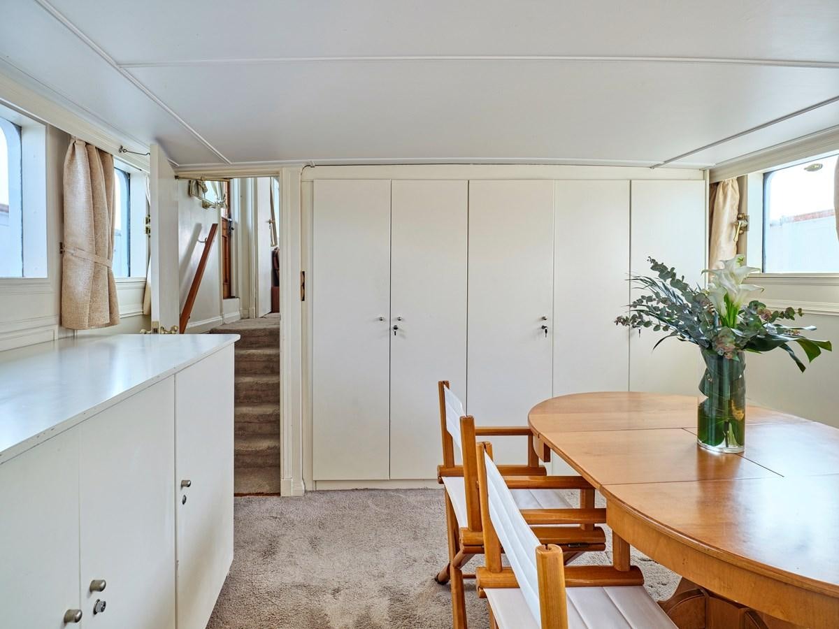 a kitchen with white cabinets aboard MIDNIGHT SUN Yacht for Sale