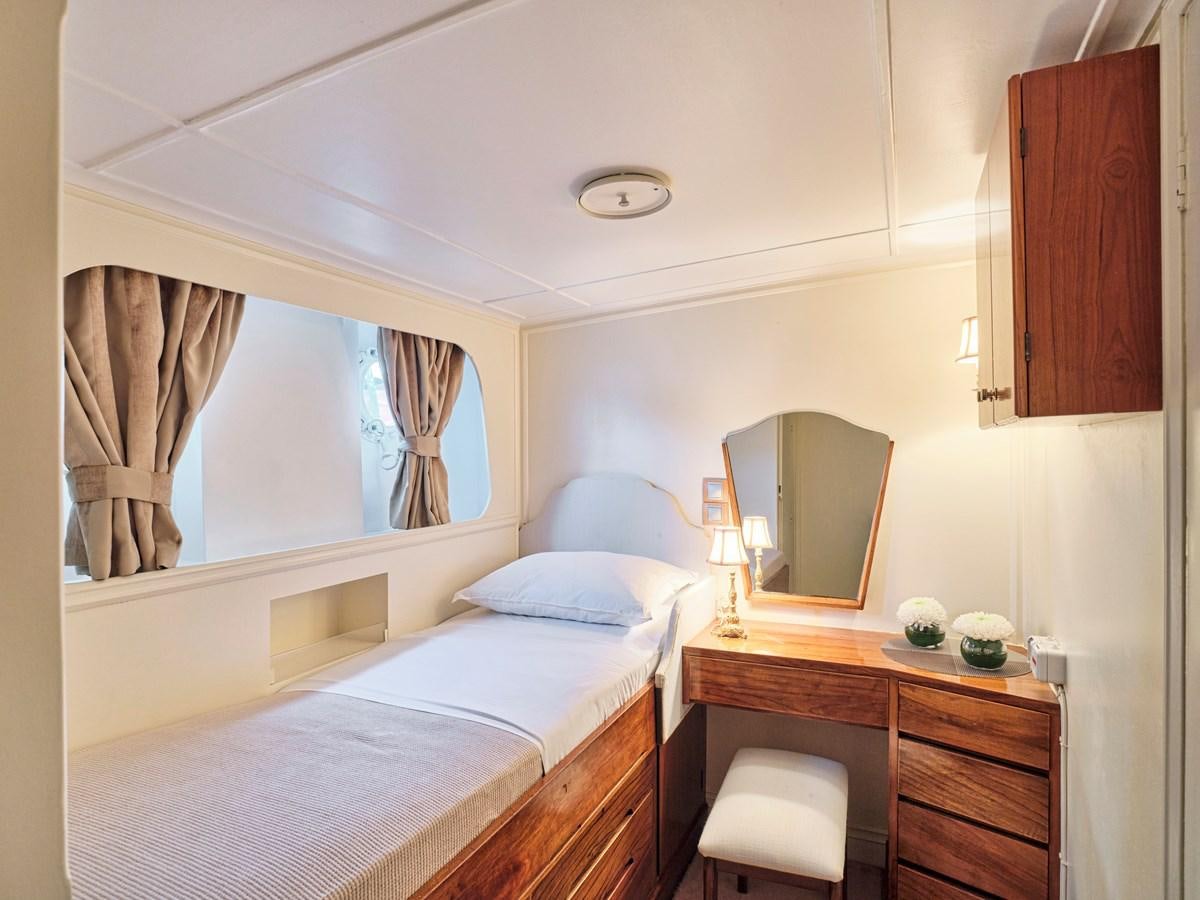 a bedroom with a bed and a mirror aboard MIDNIGHT SUN Yacht for Sale