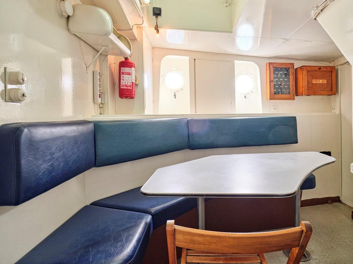 a room with a table and chairs aboard MIDNIGHT SUN Yacht for Sale