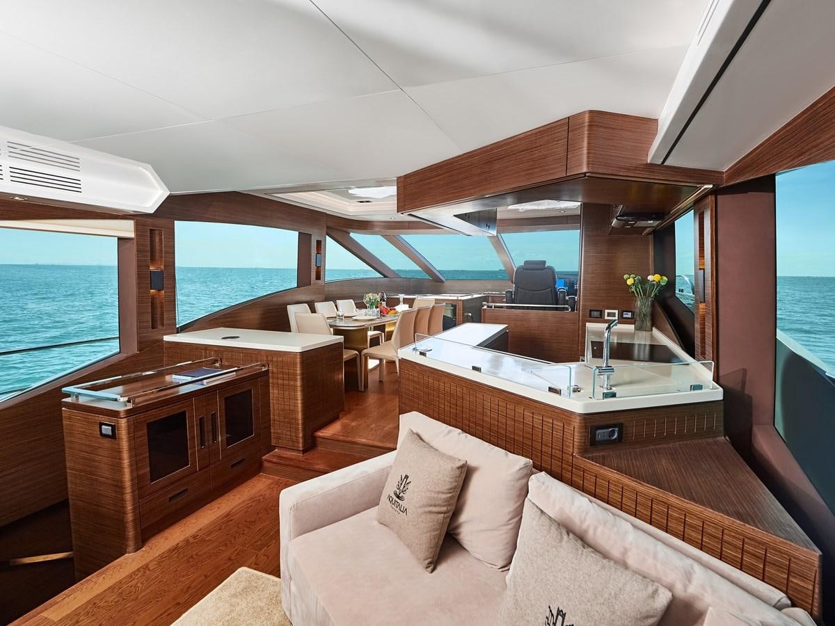 a modern looking living room with a large open window aboard DIVA RITA Yacht for Sale
