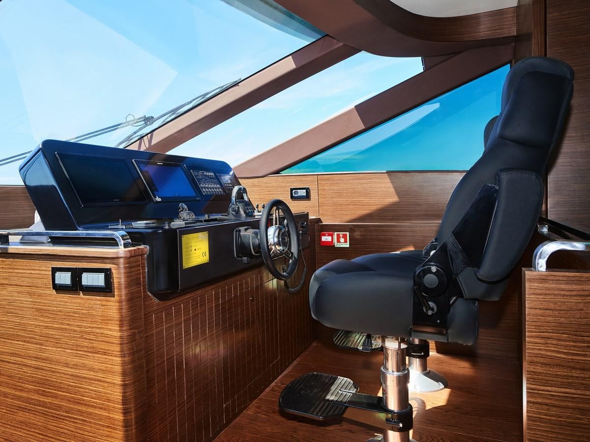 a black chair in front of a black computer desk aboard DIVA RITA Yacht for Sale