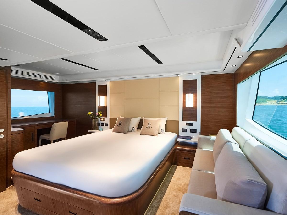 a large bedroom with a large bed aboard DIVA RITA Yacht for Sale
