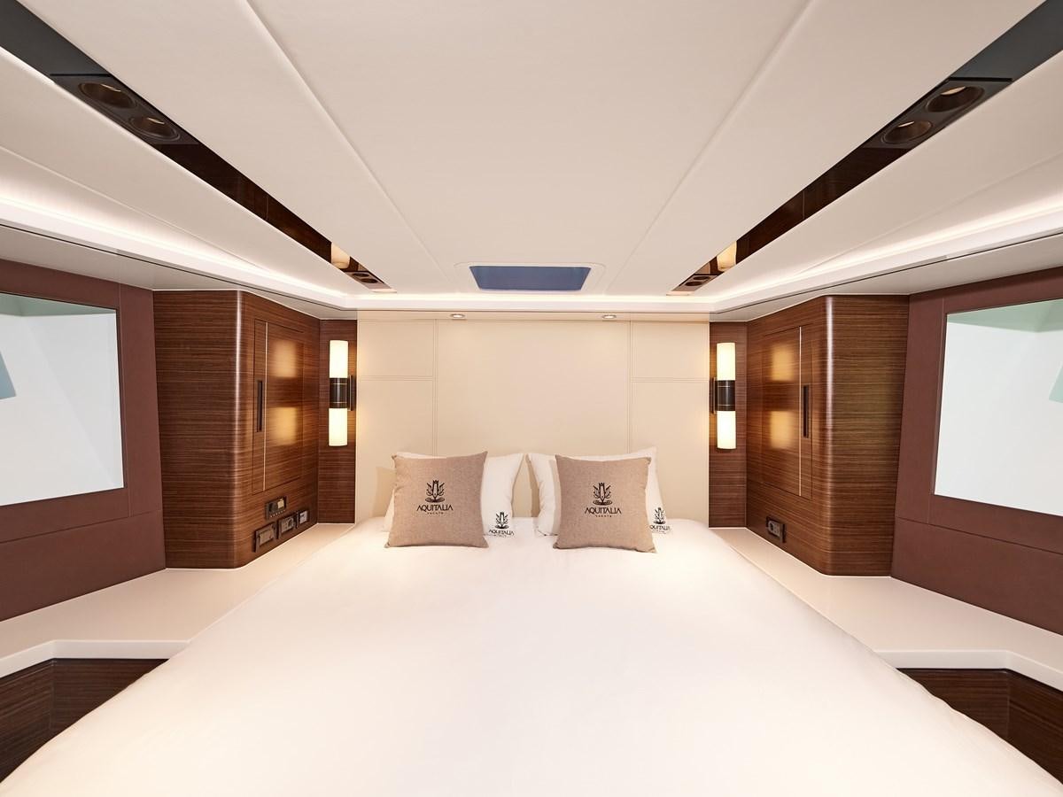 a large bed in a room aboard DIVA RITA Yacht for Sale