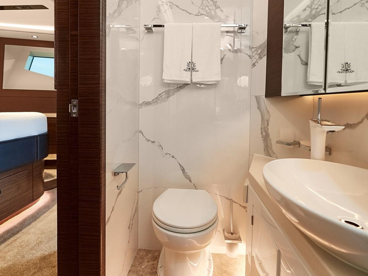 a bathroom with a toilet sink and a bathtub aboard DIVA RITA Yacht for Sale