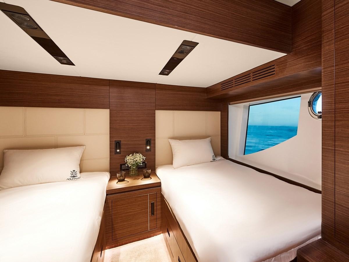 a room with a bed and a tv aboard DIVA RITA Yacht for Sale
