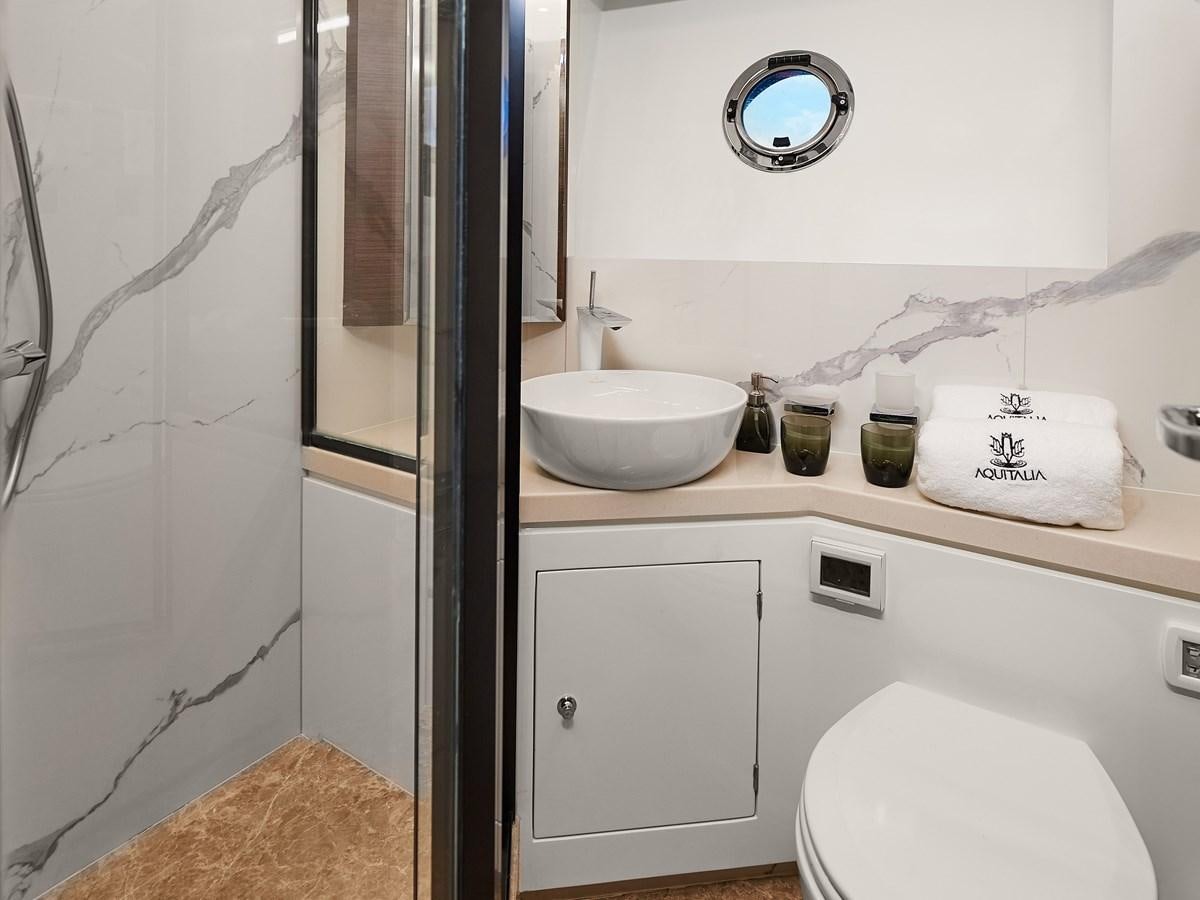 a bathroom with a sink and toilet aboard DIVA RITA Yacht for Sale