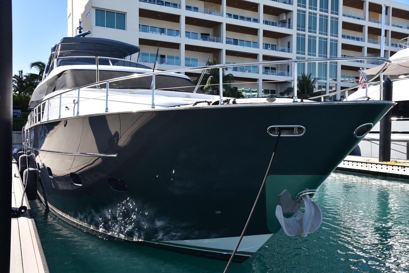 a boat docked at a pier aboard KIND OF BLUE Yacht for Sale