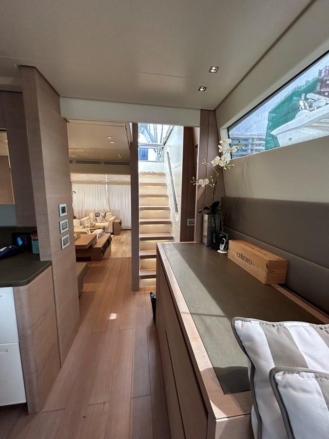 a room with a table and chairs aboard KIND OF BLUE Yacht for Sale