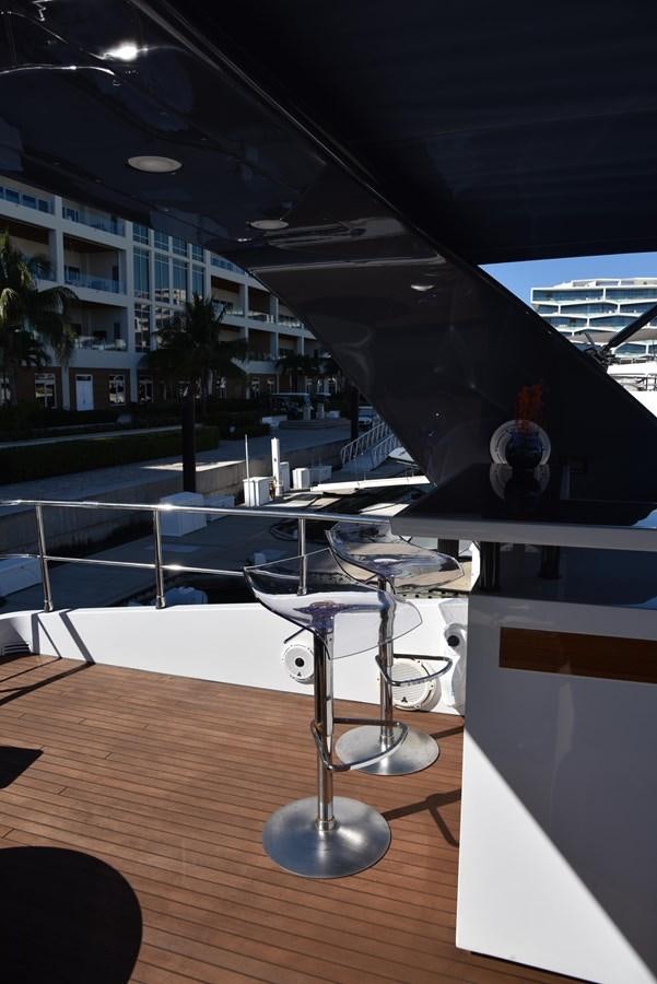 a glass table in a room aboard KIND OF BLUE Yacht for Sale