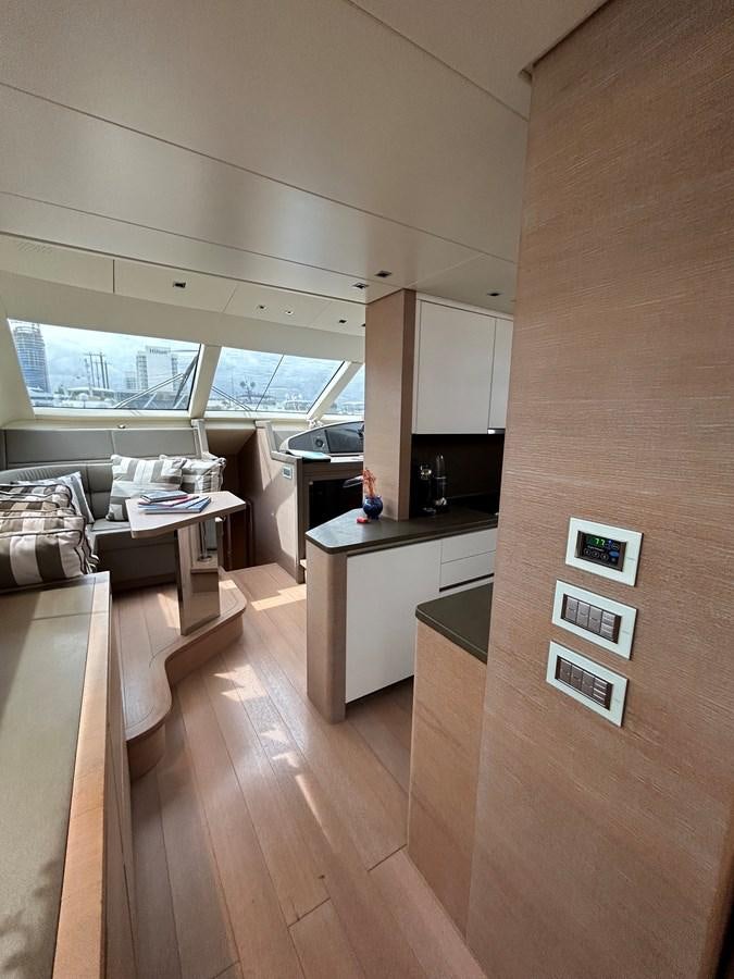 a room with a wood floor and a desk with a window aboard KIND OF BLUE Yacht for Sale