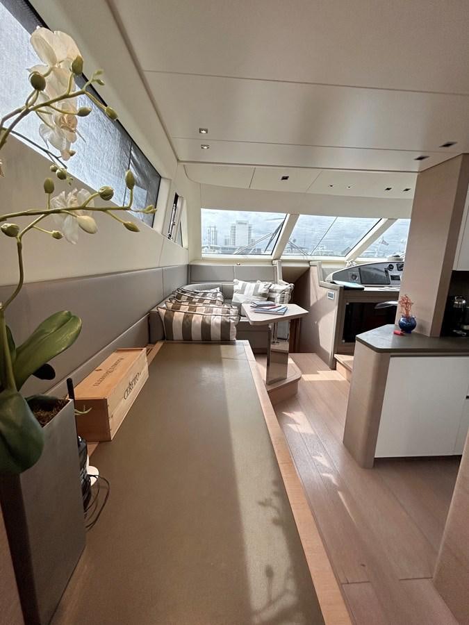 a living room with a wood floor aboard KIND OF BLUE Yacht for Sale