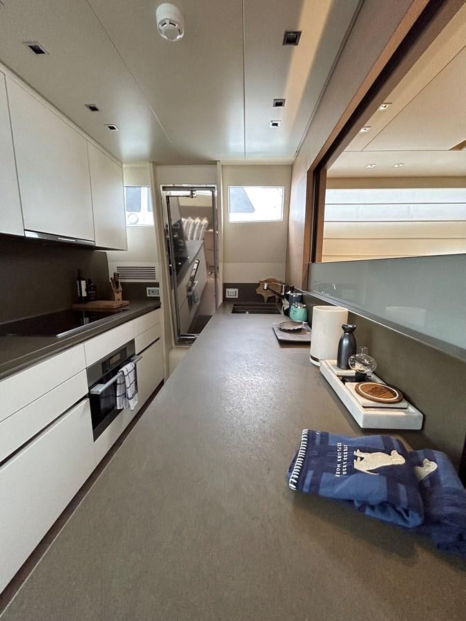 a room with a bed and a sink aboard KIND OF BLUE Yacht for Sale