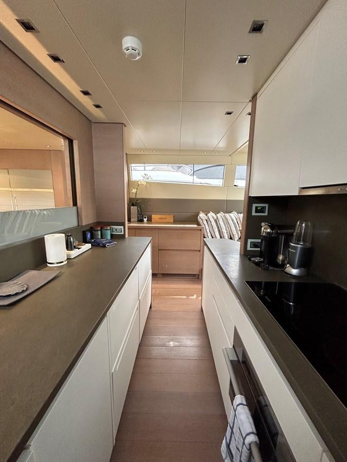 a kitchen with a large island aboard KIND OF BLUE Yacht for Sale
