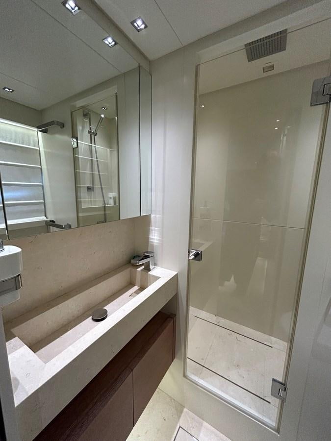 a bathroom with a bathtub and sink aboard KIND OF BLUE Yacht for Sale