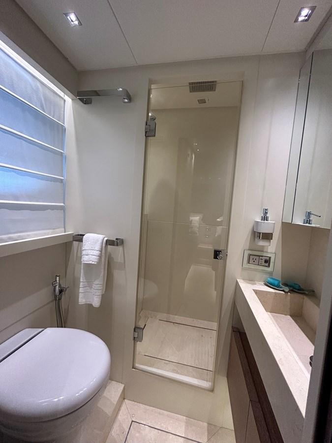 a bathroom with a shower and toilet aboard KIND OF BLUE Yacht for Sale