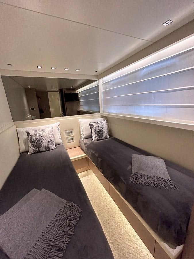 a large bedroom with a large window aboard KIND OF BLUE Yacht for Sale