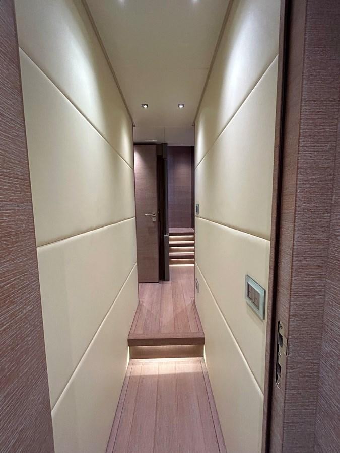 a hallway with doors and a wood floor aboard KIND OF BLUE Yacht for Sale
