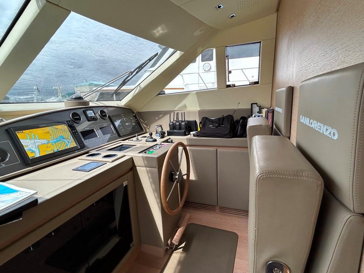 a plane cockpit with a desk and a chair aboard KIND OF BLUE Yacht for Sale
