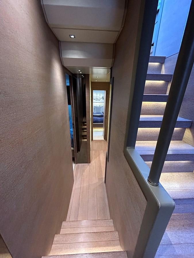 a hallway with a door and windows aboard KIND OF BLUE Yacht for Sale