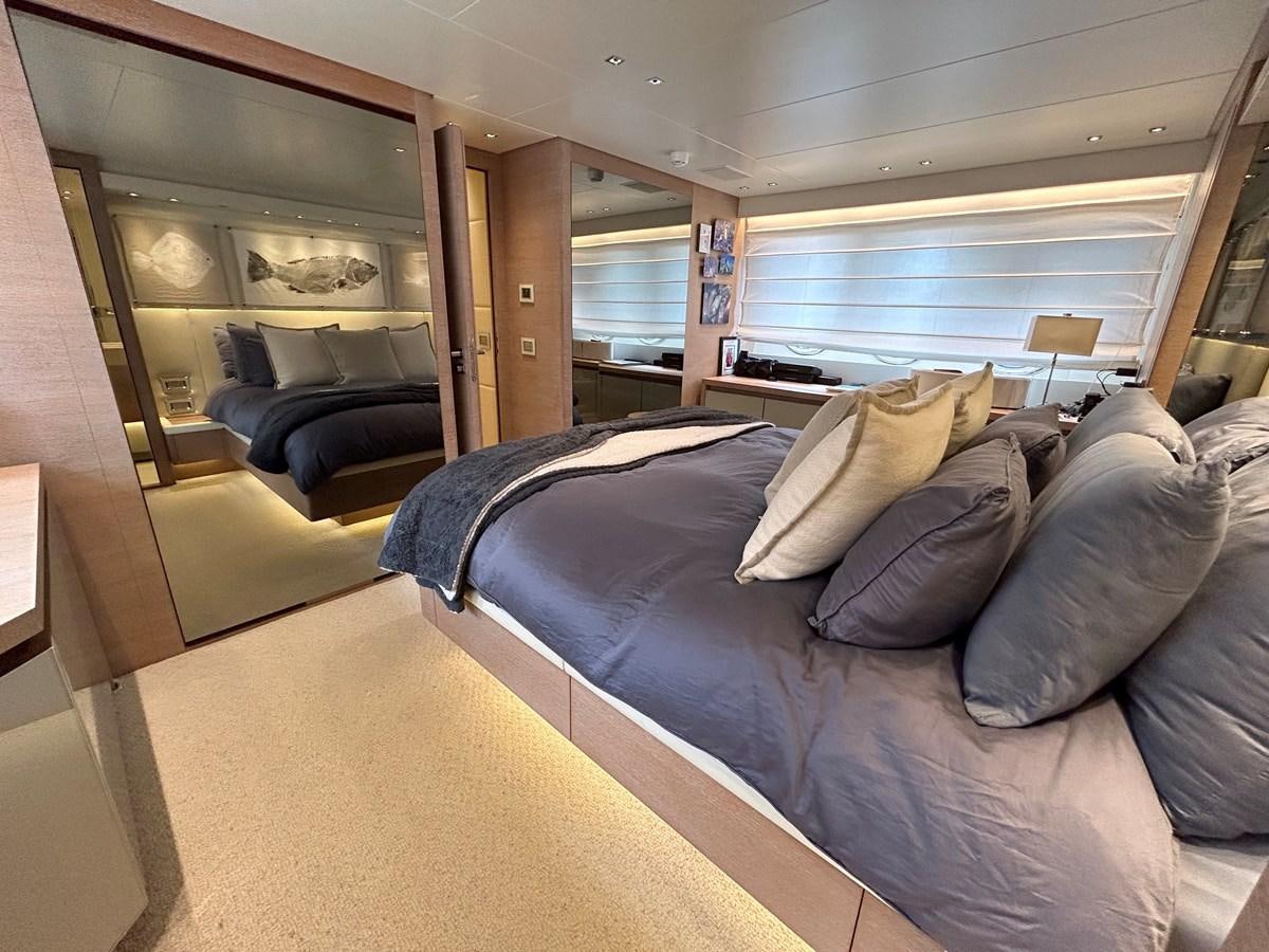 a room with a bed and a couch aboard KIND OF BLUE Yacht for Sale