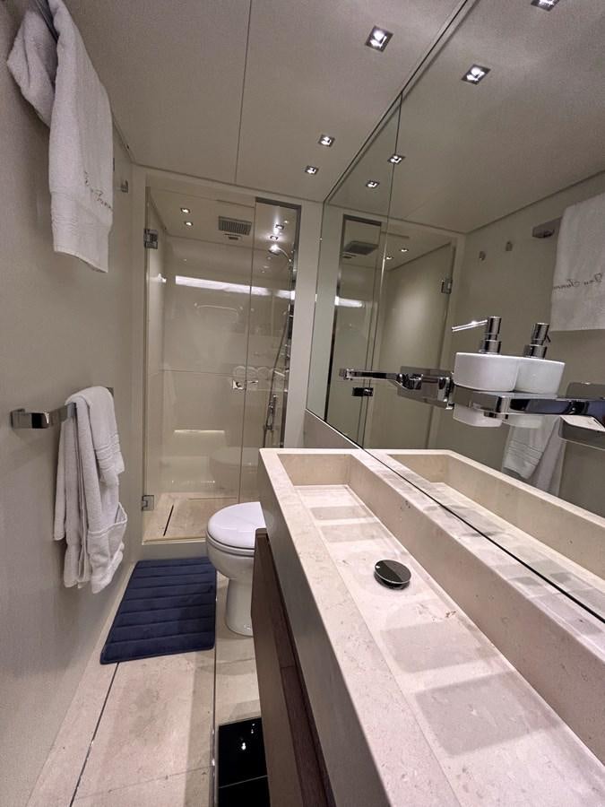 a bathroom with a tub sink and toilet aboard KIND OF BLUE Yacht for Sale