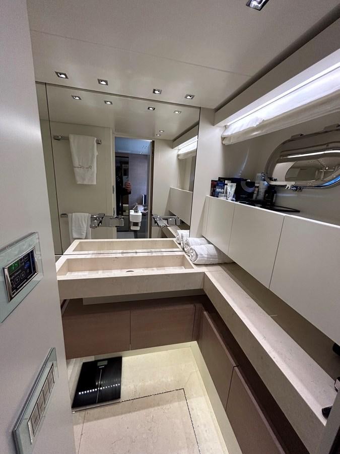 a bathroom with a sink and a mirror aboard KIND OF BLUE Yacht for Sale