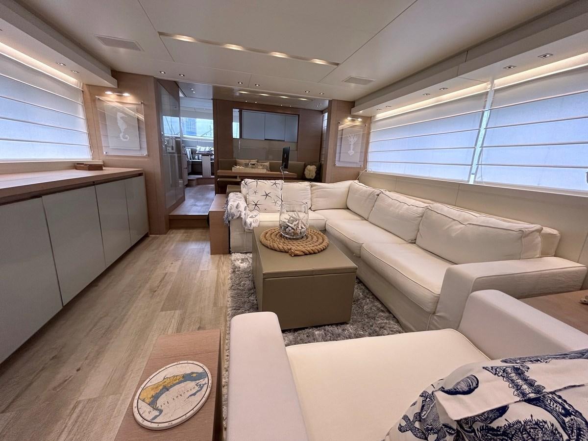 a living room with a large window aboard KIND OF BLUE Yacht for Sale