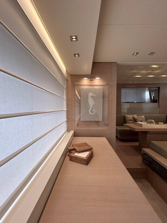 a room with a couch and a table aboard KIND OF BLUE Yacht for Sale