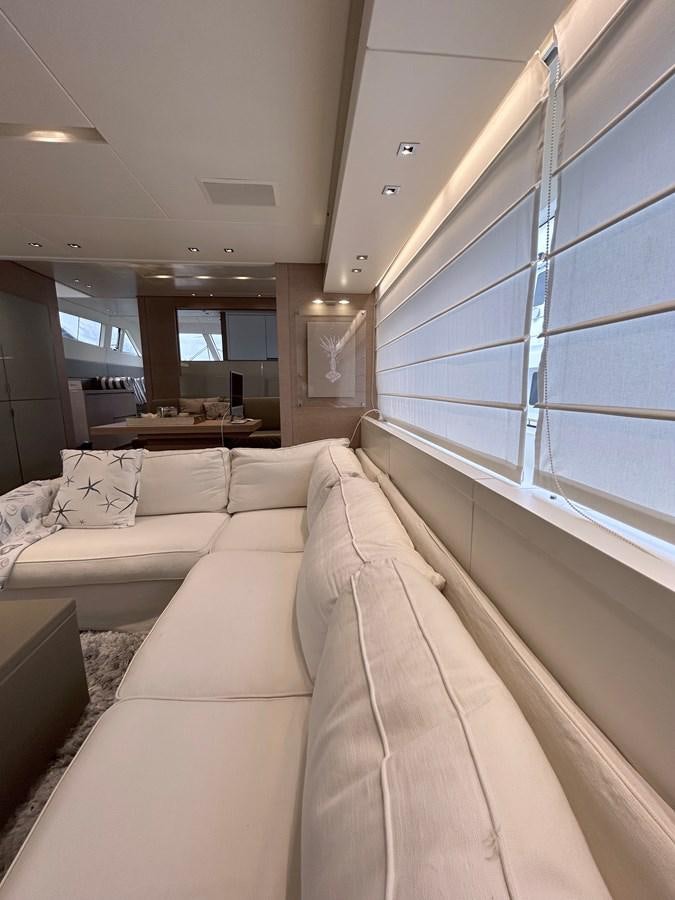 a room with a couch and a table aboard KIND OF BLUE Yacht for Sale