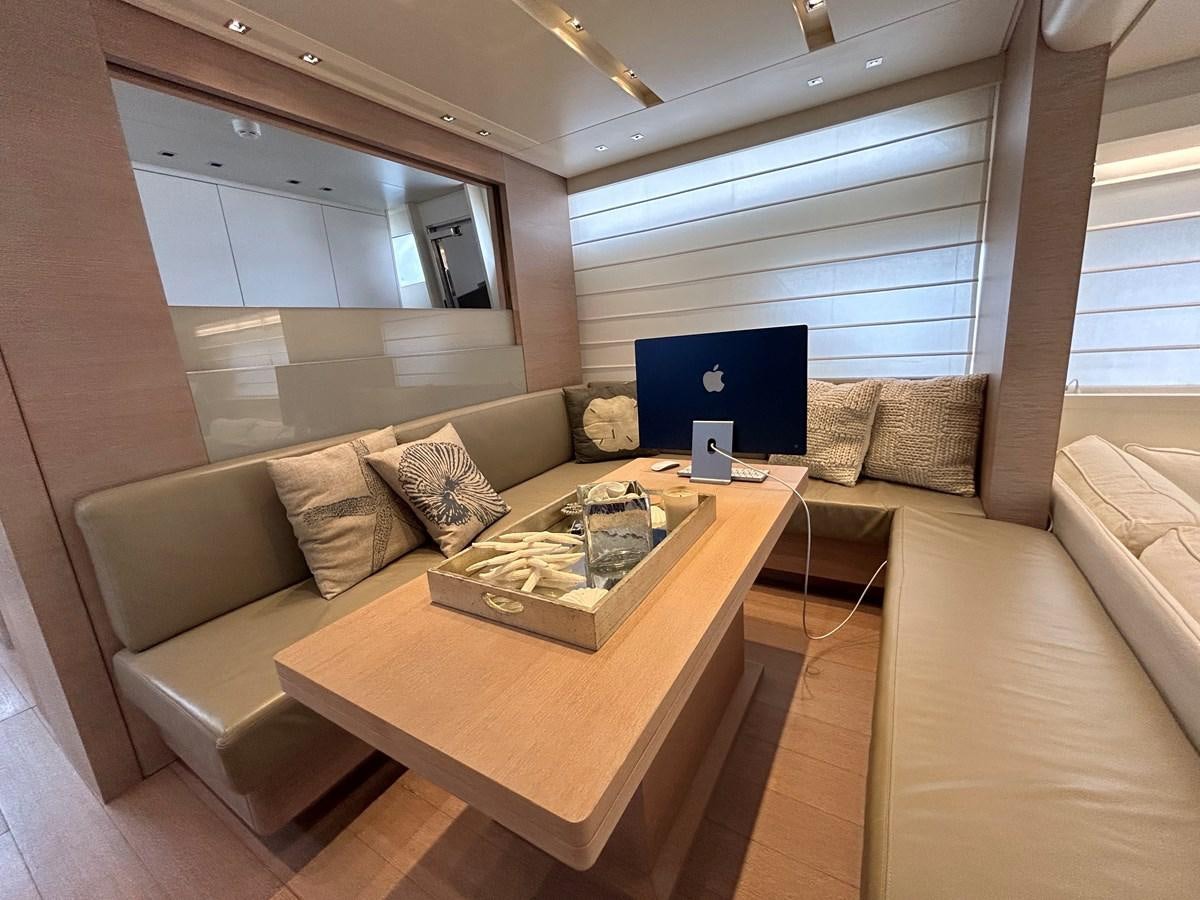a living room with a couch and a table aboard KIND OF BLUE Yacht for Sale