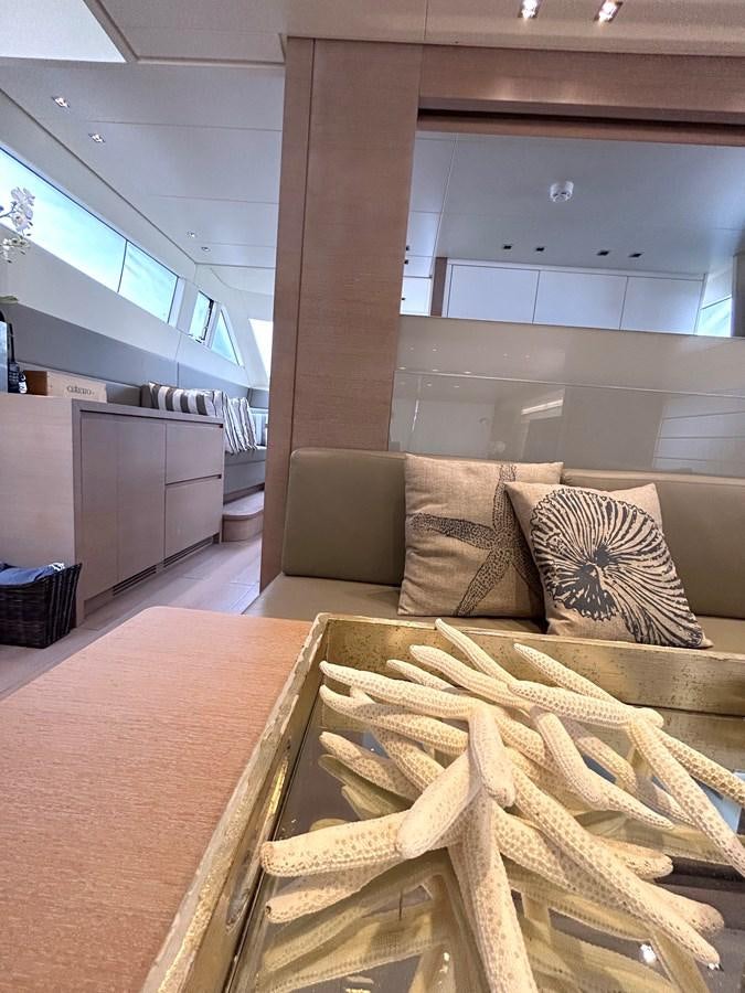a living room with a couch and a fireplace aboard KIND OF BLUE Yacht for Sale