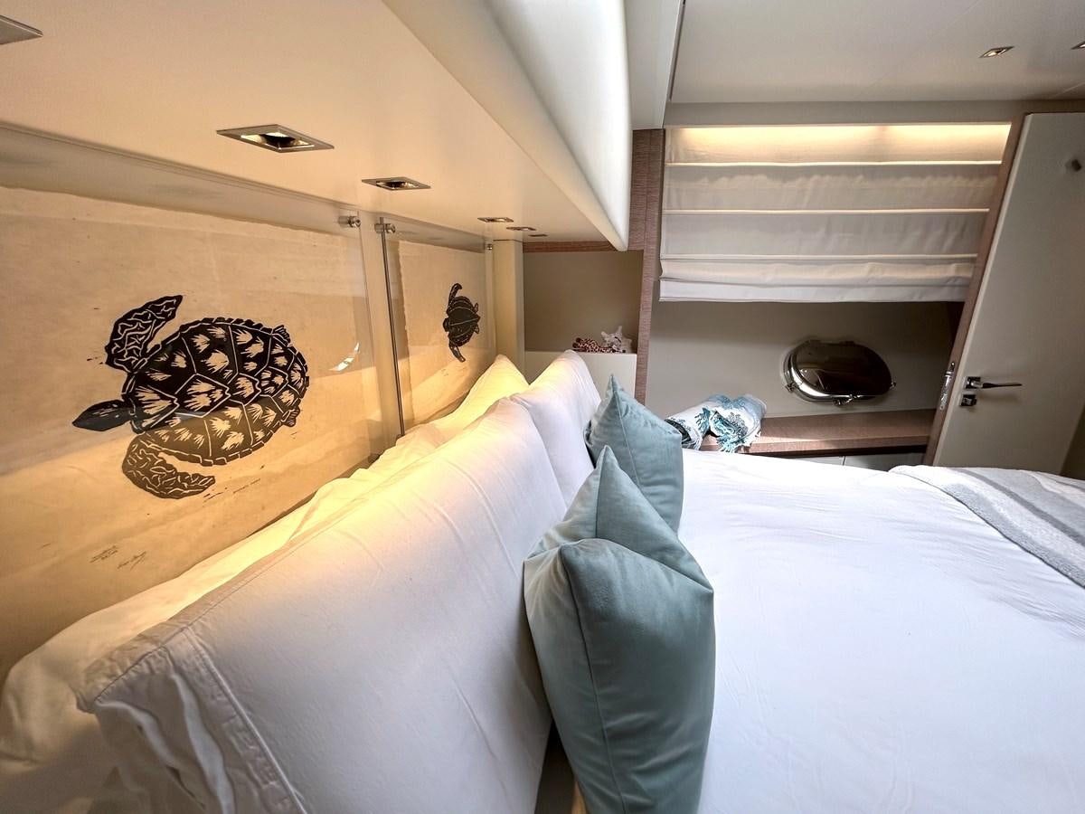 a person lying on a bed aboard KIND OF BLUE Yacht for Sale
