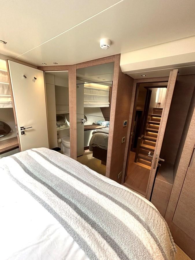 a bedroom with a bed aboard KIND OF BLUE Yacht for Sale