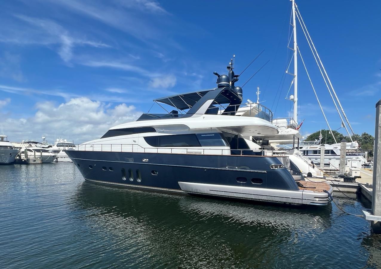 a large white yacht docked aboard KIND OF BLUE Yacht for Sale