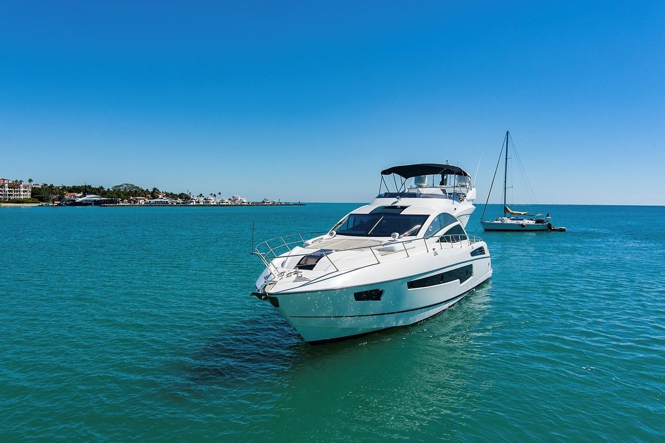 a white yacht in the water aboard KING Yacht for Sale