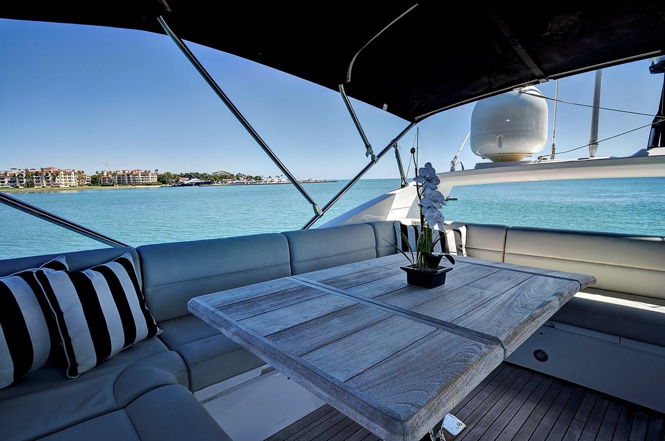 a boat with a plant on the water aboard KING Yacht for Sale