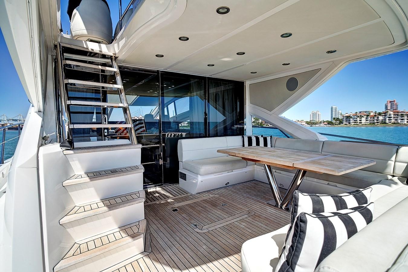 a room with a table and chairs aboard KING Yacht for Sale