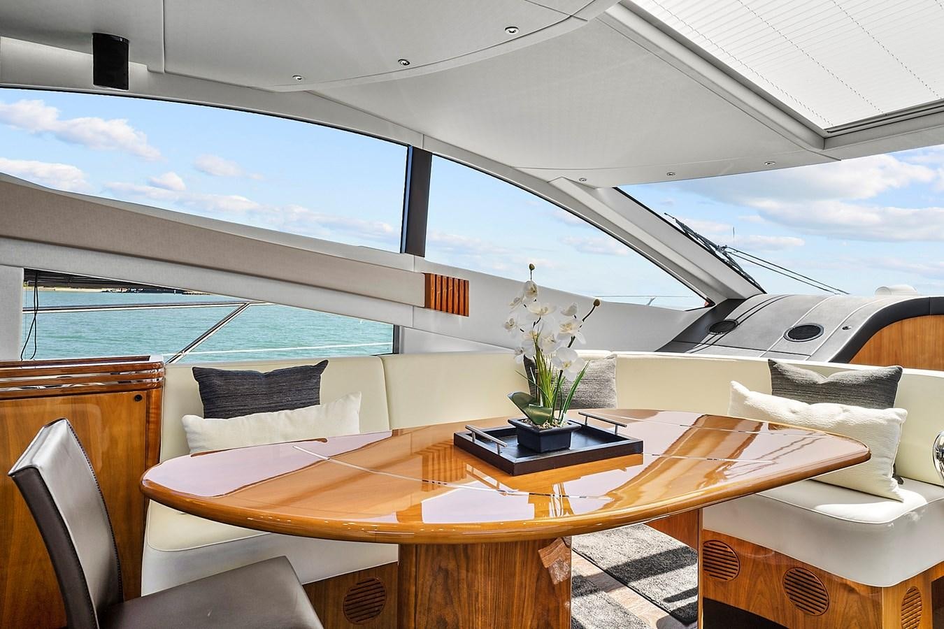 a room with a table and chairs aboard KING Yacht for Sale