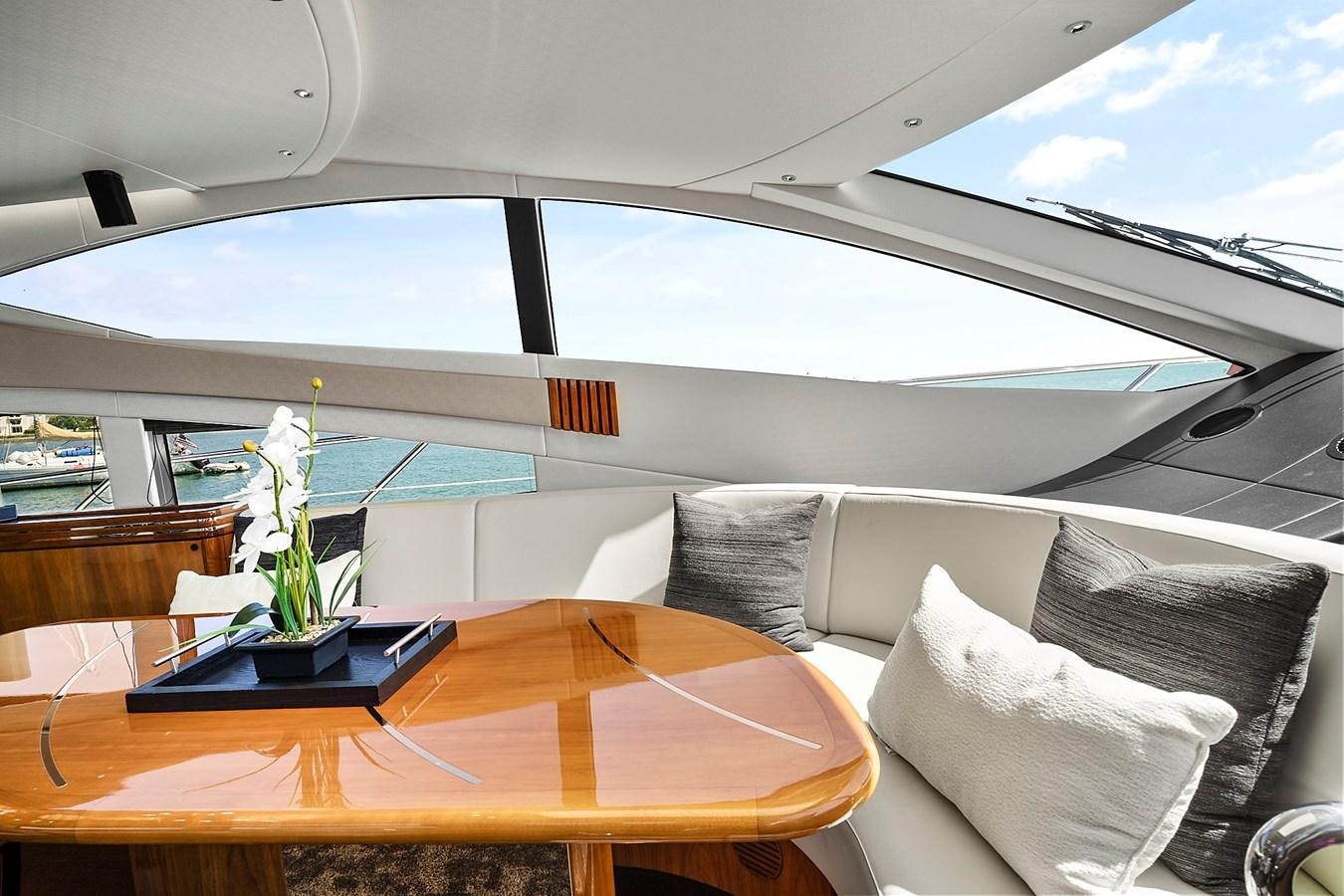 a table with pillows on it aboard KING Yacht for Sale