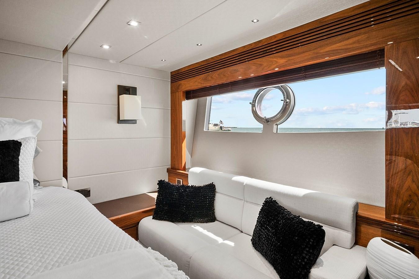 a room with a bed and a mirror aboard KING Yacht for Sale