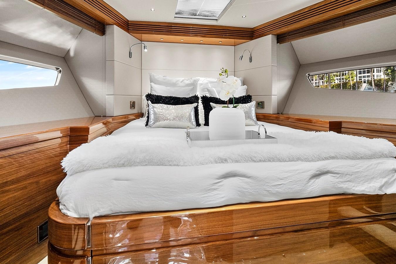 a bed with white sheets aboard KING Yacht for Sale