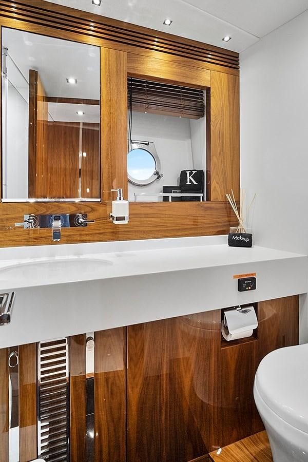a bathroom with a large mirror aboard KING Yacht for Sale