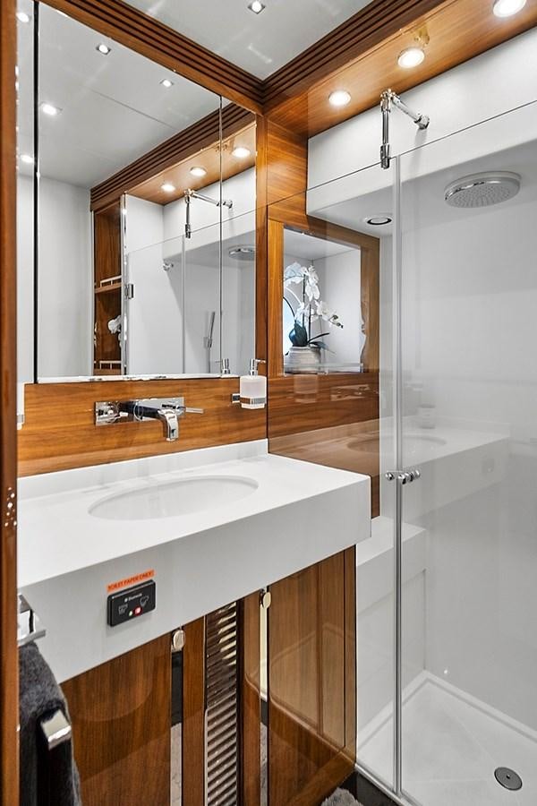 a bathroom with a sink and a mirror aboard KING Yacht for Sale