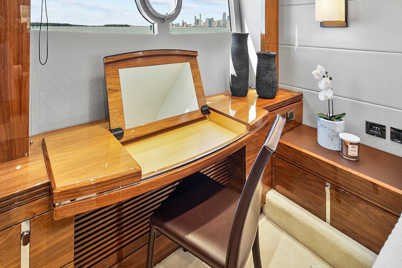 a wooden desk with a chair aboard KING Yacht for Sale