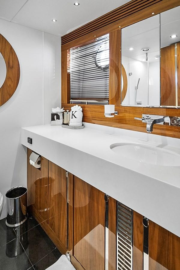 a bathroom with a large mirror aboard KING Yacht for Sale