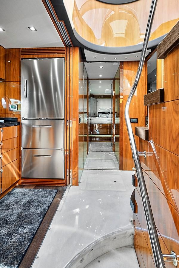 a large kitchen with stainless steel appliances aboard KING Yacht for Sale